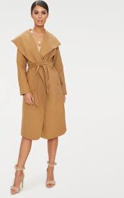 Grab a camel waterfall duster coat and layer over a black midi bodycon dress paired with some perspex mules, you're gonna look beaut, babe. Pin On Fashion Must Haves
