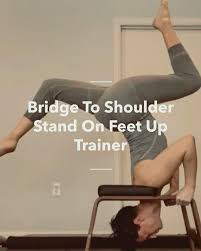 Bridge To Shoulder Stand On Feet Up Trainer Video Video In 2020 Shoulder Yoga Stretches Yoga Shoulder Yoga Inversions
