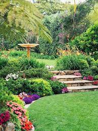 The garden on the slopes is better visible, it is not as monotonous as on the flat land. Daylily Border Around Top Level Mixed Low Shrubs And Annuals On Lower Great Steps Birdbath Focal Point Ideas 4 L Beautiful Gardens Backyard Garden Design