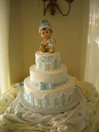 3 Tier Baby Shower Cake Made From Butter Cream With A Baby Boy On Top With A Blue Bow Made Of Butter Cream Baby Shower Cakes Amazing Cakes Engagement Cakes