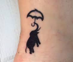 People feel a ton of respect for elephants and they are seen as an animal of pride wherever all around the world. Small Silhouette Elephant With Umbrella Tattoo Silhouette Elephant Tattoos Elephant Tattoos Crayon