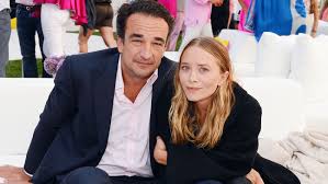 Andersen is an investment banker who worked at drexel burnham lambert during the junk bond factory's glory days in the 1980s and survived its subsequent demise. Mary Kate Olsen Married Full House Alum Weds Investment Banker Olivier Sarkozy Report The Hollywood Reporter