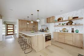 All of our unfinished cabinets are american made, and are 100% plywood construction, unlike the particle board cabinets found in bigger box stores. Open Kitchen With Flat Front Natural Alder Wood Cabinets Light Wood Floors Globe Pendants Wit Light Wood Kitchens Alder Kitchen Cabinets Natural Wood Kitchen