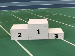 First, second and third place. Winners Podium Athletics Direct