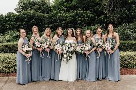 Dusty Blue Bridesmaids Dresses From Weddingtonway Blush White And Cream Roses With Ecalypt Dusty Blue Bridesmaid Dresses Blue Bridesmaids Bridesmaid Dresses