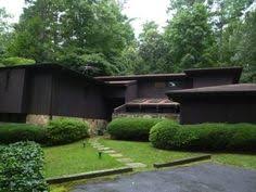 The Brown Decade Hits Hard In This Vinings Contempo Mid Century Modern House Mid Century House Architecture