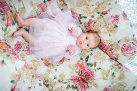 Very beautiful basket with flowers. Beautiful Baby Girl Lying Rolling Over In Bed Pillow Cover Carpet Stock Photo Picture And Royalty Free Image Image 92324891