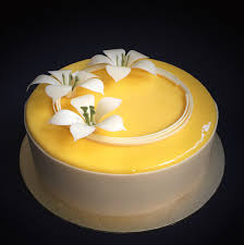 Mango Mousse Cake Layered With Mango Jelly And Mango Mirror Glaze Decorated With Chocolate Flowers And A Wrap Mango Cake Jelly Sweets Cake