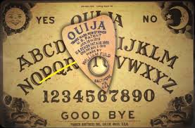 A ouija board coffee table complete with planchette coasters. How The Cardboard And Plastic Ouija Board Came To Be Trusted As An Effective Conduit To The Spiritual World