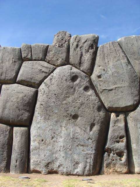 Walk Among Giants at Sacsayhuaman! 🇵🇪 #Cusco Imagine chilling next to  these HUGE stone walls in Peru! They're part of a fortress called  Sacsayhuaman, built without any mortar! The Inca were seriously