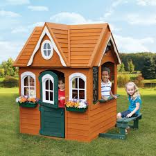 Cedar playhouse with interior sink and stove. 5 Amazing Playhouse Playset Makeovers Chris Loves Julia