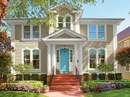 The contrast of the black against a backdrop of verdant green truly makes the house the star of the show. 59 Inviting Colors To Paint A Front Door Colorful Front Doors Hgtv