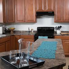 Next, put masking tape on the edges of the cabinets to protect them from damage. Installing A Tile Backsplash