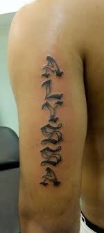 This is a great hand tattoo and uses darker shades to give off a mysterious look. Bicep Name Tattoo Ideas Names Tattoos For Men Tattoo Fonts Back Tattoos For Guys
