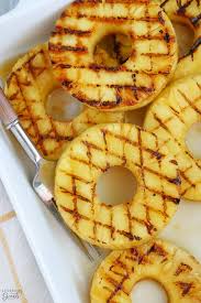 Toss pineapple spears in melted butter and then brown sugar, coating each one as evenly as possible. Easy Grilled Pineapple Celebrating Sweets