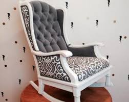 Flip the upholstered piece over, remove the staples around the edges of the bottom covering fabric. Refurbished Cane Chair The Rocker Wonder Rocking Chair Wingback Tufted Chair Nursery Upholstered Rocking Chairs Furniture Vintage Rocking Chair
