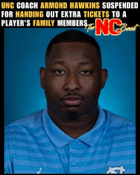 UNC cornerbacks coach #ArmondHawkins just got hit with a suspension after  being accused of handing out extra tickets and sideline passes to a  player's family—violating NCAA rules.