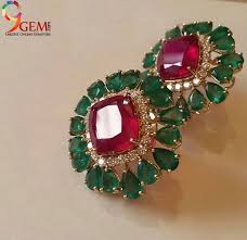 Beautiful Ruby Gemstone Embedded With Emerald Stone Stud Earrings Add More Class To Your Attire Gold Earrings Designs Gold Jewelry Fashion Beautiful Jewelry