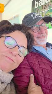 We are waiting at the airport with my loving husband...