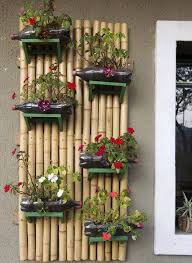 Hanging Bamboo Wall Garden With Plastic Bottle Planters You Could Also Use Regular Planting Containers Very Pretty Bamboo Garden Bottle Garden Flower Pots