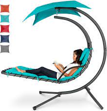 If you like to lounge around with a friend, a double chaise lounge pairs together two separate seats, which makes it easier to chat. Amazon Com Best Choice Products Outdoor Hanging Curved Steel Chaise Lounge Chair Swing W Built In Pillow And Removable Canopy Teal Garden Outdoor
