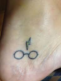 Harry Potter Glasses And Lightning Bolt Scar Tattoo On Foot Bolt Tattoo Lightning Bolt Tattoo Scar Tattoo