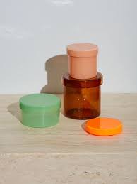 You could make a collage out of images cut from different magazines, or you could use decorative you could even glue the lids of the jars to the underside of a shelf so that the jars are accessible without taking up any desk space. 30 Bathroom Storage Solutions To Satisfy Your Inner Neat Freak Glass Containers Bathroom Storage Solutions Glass Containers With Lids