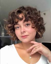 For women looking to have a longer pixie cut before committing to a shorter shape this is a great. 29 Short Curly Hairstyles To Enhance Your Face Shape