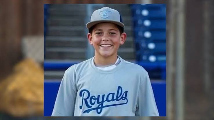 Family of Xavier Taylor throw out 1st pitch at Little League game