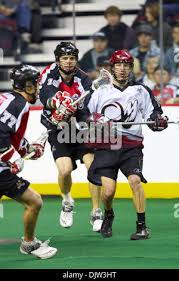 Calgary Roughnecks defenceman Curtis Manning (10) manoeuvres passed  Philadelphia WIngs forward Kevin Huntley (50) during a game at the  Pengrowth Saddledome in Calgary, Alberta. (Credit Image: © Irena  Thompson/Southcreek Global/ZUMApress.com Stock Photo -