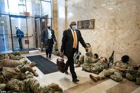 Members of the national guard sleep in the halls of capitol hill as the house of representativs convene to impeach president. Dc Hunkers Down National Guard Troops Rest And Fence Is Erected At Trump Hotel Daily Mail Online
