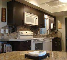 Black appliances give you a little more freedom to play with the design of your kitchen as they pair well with a range of cabinet finishes. 14 Kitchen Cabinet Repair Ideas Kitchen Cabinets Repair Kitchen Remodel Kitchen Cabinets
