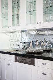 We did not find results for: Wet Bar Features Glass Front Upper Cabinets Lined With Glass Shelves And White Lower Cabinets Paired W Black Tiles Kitchen Bar Backsplash Glass Shelves Kitchen