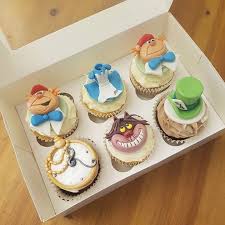 6 prepared cupcakes (white liners) ½ cup wilton's black chocolate discs; Alice In Wonderland Cupcakes Save The Date Collective