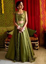 Buy Niti Taylor In Kalki Parrot Green Lehenga And Crop Top In Raw Silk With A Matching Heavy Embroidered Long Jacket The party wear jacket on offer are stylish and affordable to help you save money while looking awesome. niti taylor in kalki parrot green lehenga and crop top in raw silk with a matching heavy embroidered long jacket