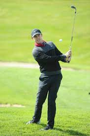 Rory Mcilroy Wearing Nike Lunar Control 4 Golf Shoes Nike Golf Range Cb V Neck Sweater In Anthracite Black Metallic Silver Nike S Golf Hats Rory Mcilroy Golf
