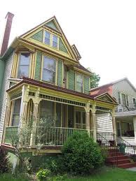 To give your beige exterior a more sophisticated feel, try painting the shutters and front door black. Pale Green And Yellow House Exterior Paint Colors For House Exterior House Colors Victorian Style Homes