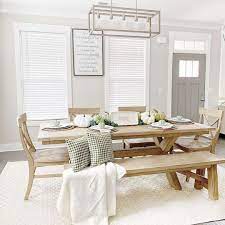 Interior of modern dining room with gray walls, white wooden floor, white table with chairs and bookshelves on. 18 Gray Dining Room Design Ideas