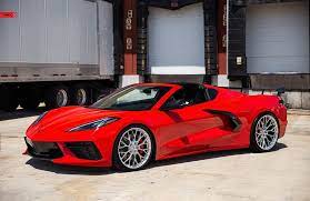 Closeup rectangular background of a chrome classic car logo on a bright yellow hood reflecting clouds in the sky. Pics 2020 Corvette Stingray On Anrky S An10 Seriesone Polished Wheels Corvette Sales News Lifestyle