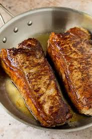 Tuscan cooks know that all it takes to bring out the flavor of a rich cut of beef is a squeeze of fresh lemon juice. New York Strip Steak With Garlic Butter Dinner At The Zoo