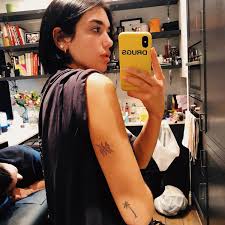 Dua lipa has several cool tattoos on her arms. What Does Dua Lipa S 245 Tattoo Mean Popsugar Beauty
