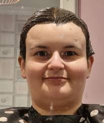 I have had my Hair dyed I was taking photos I looked back seen this one  then I remembered the Antichrist Superstar photo I used a graphics program  to edit my photo