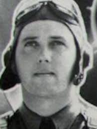 Gunner Kenneth Bratton, wounded in the knee by shrapnel, being pulled out  of the turret of a TBF Avenger aircraft aboard USS Saratoga after a  successful raid