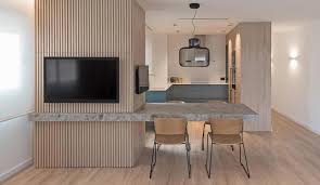 a cantilevered dining table separates