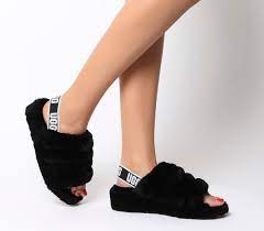 Slides are the perfect shoes to slip on when running to the store or hanging out by the pool and right now you can get a name brand pair for super cheap. Ugg Fluff Yeah Slides Black Slippers