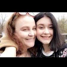 My son graduates in December. One of his sisters does not have a federal ID  but is flying using her passport. Is she able to come to graduation with a  normal drivers