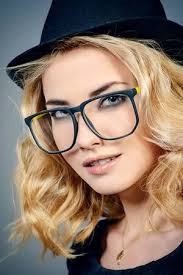 The traditional thick top bar is the original, but a few of our frames have a more subtle thin line, giving them a slightly more modern feel. Close Up Portrait Of A Young Woman With Beautiful Blonde Hair Wearing Glasses Optics Eyewear Sty Beautiful Blonde Hair Eyewear Inspiration Close Up Portraits