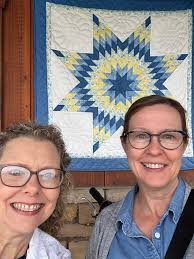 Lone star quilt with Hawaiian quilt block corners