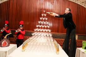 Never has there been a better champagne tower than this one complete with a  marching band and a man on stilts at the @gohar.world @champagne_lallier  Spring Fling 🍓 #ad21