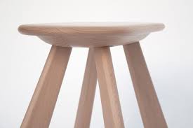 The stool features a comfortably larger seat seat and footrests. Atlas Sculptural Solid Wood Stool 24d Studio